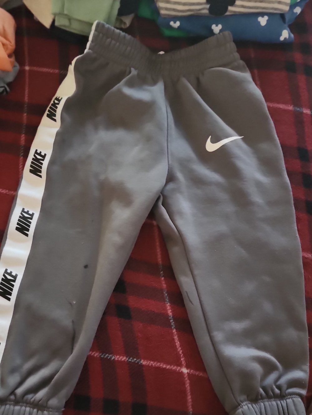 Nike Kids Gray Sweatpants with White Swoosh and Branded Side Tape